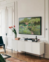 Garden Path by Julia Purinton. shown as a framed stretched canvas in a living room above a console. Available as a archival giclee rolled canvas, fine art paper, or poster print. SKU 93107i.