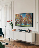 Kaleidoscope Bright Blue by Julia Purinton. shown as a framed stretched canvas in a living room above a console. Available as a archival giclee rolled canvas, fine art paper, or poster print. SKU 37739i.