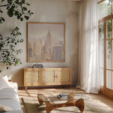 Manhattan in the Mist by Julia Purinton. Shown in a natural wood frame in a cozy modern living room. Available as an archival giclee rolled canvas, fine art paper, or poster print. SKU 43390a.