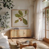 Oak Branch Crop by Julia Purinton. Shown in a natural wood frame in a cozy modern living room. Available as an archival giclee rolled canvas, fine art paper, or poster print. SKU 76833a.