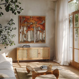 October Woods Light by Julia Purinton. Shown in a natural wood frame in a cozy modern living room. Available as an archival giclee rolled canvas, fine art paper, or poster print. SKU 33483a.