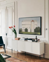 On the Farm Light by Julia Purinton. shown as a framed stretched canvas in a living room above a console. Available as a archival giclee rolled canvas, fine art paper, or poster print. SKU 58256i.