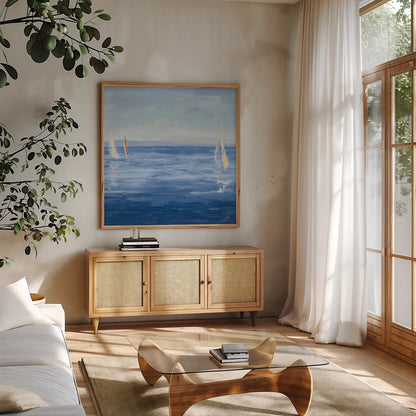 Open Sail with Red Crop by Julia Purinton. Shown in a natural wood frame in a cozy modern living room. Available as an archival giclee rolled canvas, fine art paper, or poster print. SKU 47775a.