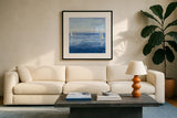 Open Sail with Red Crop by Julia Purinton. Displayed in a glass frame with matte in a clean modern living room. Available as an archival giclee rolled canvas, fine art paper, or poster print. SKU 47775a.
