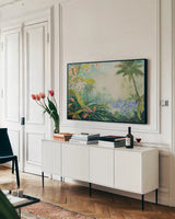 Orchids by the River by Julia Purinton. shown as a framed stretched canvas in a living room above a console. Available as a archival giclee rolled canvas, fine art paper, or poster print. SKU 78729i.