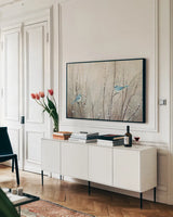 Pretty Birds Neutral by Julia Purinton. shown as a framed stretched canvas in a living room above a console. Available as a archival giclee rolled canvas, fine art paper, or poster print. SKU 35717i.