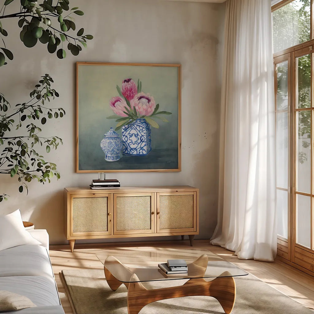 Protea Chinoiserie II by Julia Purinton. Shown in a natural wood frame in a cozy modern living room. Available as an archival giclee rolled canvas, fine art paper, or poster print. SKU 72078a.