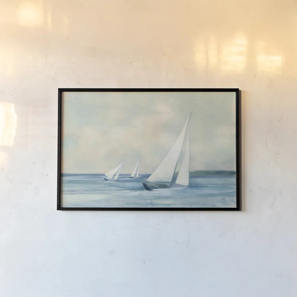 Sailboats at Sunrise by Julia Purinton. shown as a paper print in a black flame. Available as a archival giclee rolled canvas, fine art paper, or poster print. SKU 62632i.