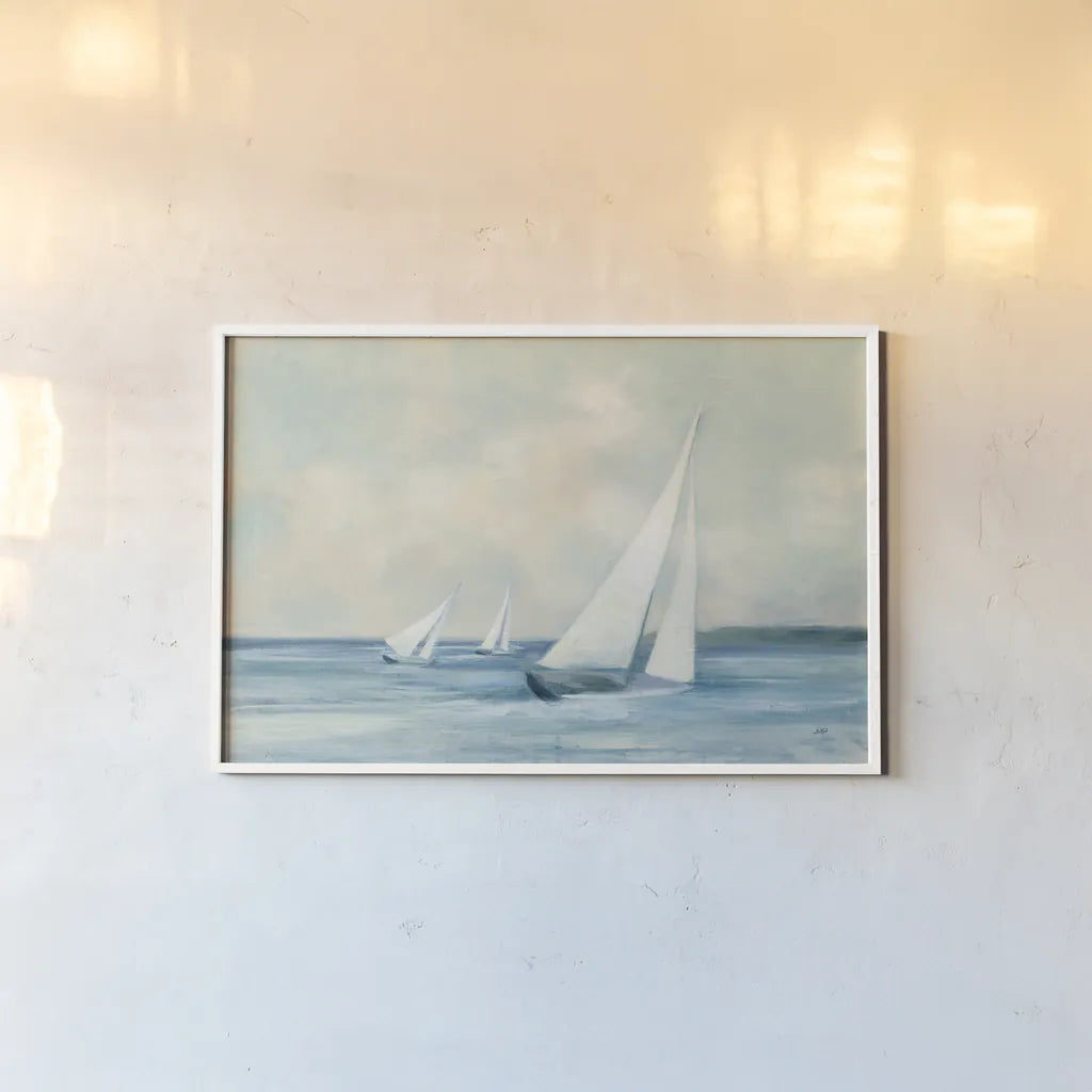 Sailboats at Sunrise by Julia Purinton. shown as a paper print in a white frame. Available as a archival giclee rolled canvas, fine art paper, or poster print. SKU 62632i.