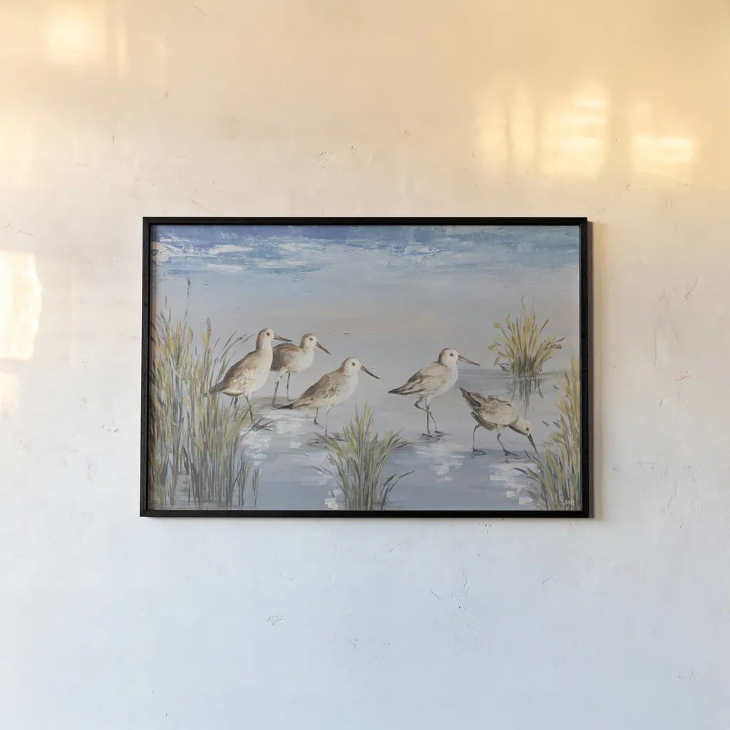 Sandpiper Stroll by Julia Purinton. shown as a paper print in a black flame. Available as a archival giclee rolled canvas, fine art paper, or poster print. SKU 99749i.