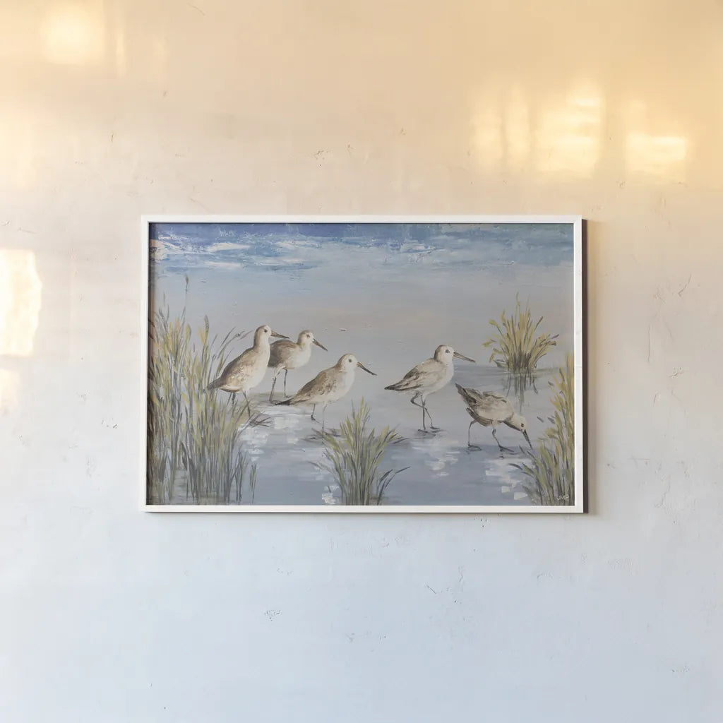 Sandpiper Stroll by Julia Purinton. shown as a paper print in a white frame. Available as a archival giclee rolled canvas, fine art paper, or poster print. SKU 99749i.