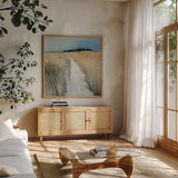 Sandy Path by Julia Purinton. Shown in a natural wood frame in a cozy modern living room. Available as an archival giclee rolled canvas, fine art paper, or poster print. SKU 102763a.