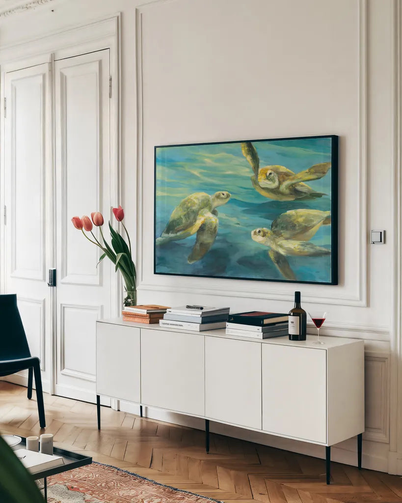 Sea Turtles by Julia Purinton. shown as a framed stretched canvas in a living room above a console. Available as a archival giclee rolled canvas, fine art paper, or poster print. SKU 66555i.