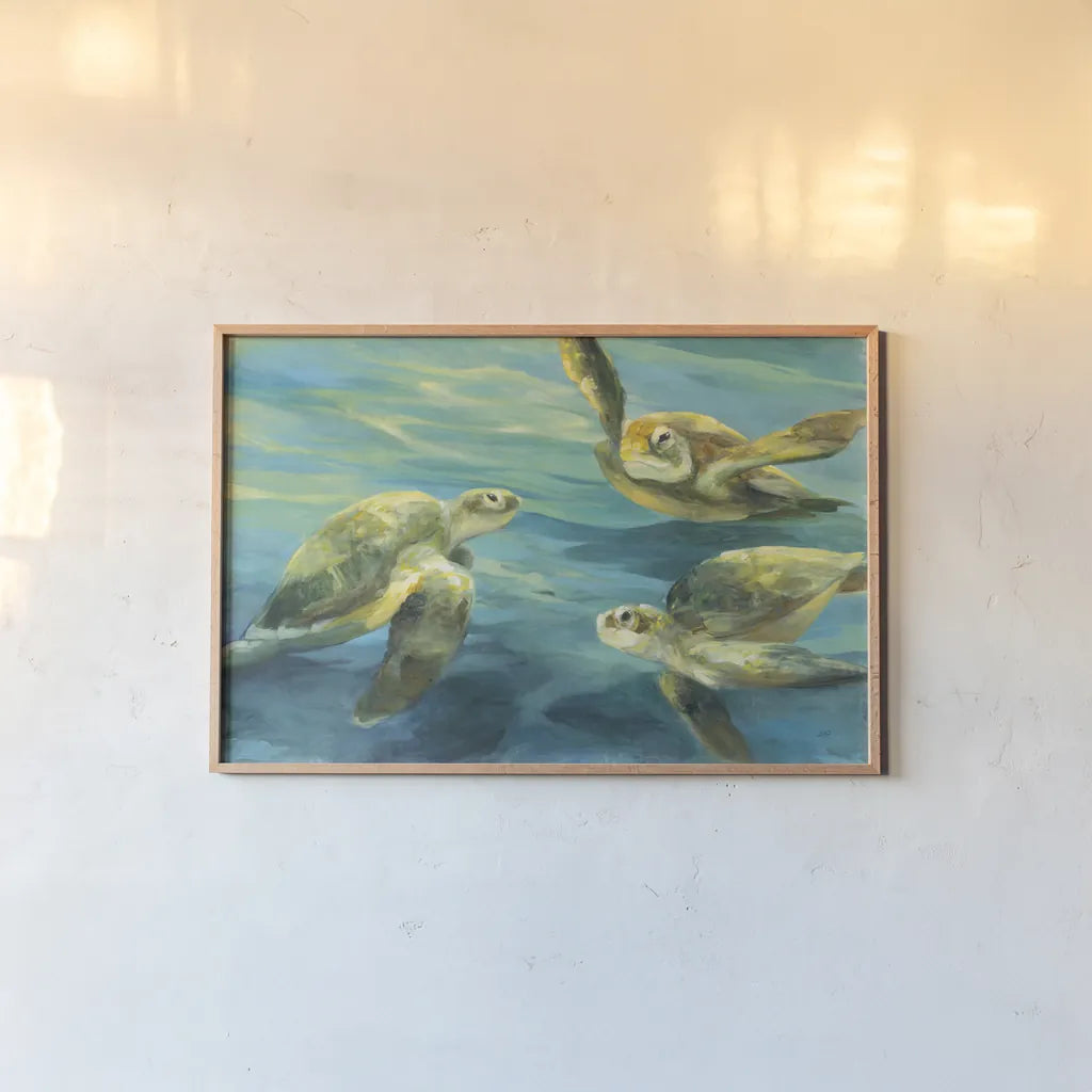 Sea Turtles by Julia Purinton. shown as a paper print in a natural frame. Available as a archival giclee rolled canvas, fine art paper, or poster print. SKU 66555i.