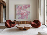 Spring Magnolia I by Julia Purinton. Shown as extra-large giant wall art in a modern living room. Available as an archival giclee rolled canvas, fine art paper, or poster print. SKU 63245a.
