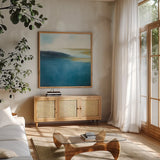 Subtle Sea by Julia Purinton. Shown in a natural wood frame in a cozy modern living room. Available as an archival giclee rolled canvas, fine art paper, or poster print. SKU 78367a.