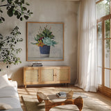 Succulent Still Life I Navy by Julia Purinton. Shown in a natural wood frame in a cozy modern living room. Available as an archival giclee rolled canvas, fine art paper, or poster print. SKU 63531a.