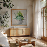 Succulent Still Life II by Julia Purinton. Shown in a natural wood frame in a cozy modern living room. Available as an archival giclee rolled canvas, fine art paper, or poster print. SKU 59960a.