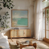 Summer Coastline by Julia Purinton. Shown in a natural wood frame in a cozy modern living room. Available as an archival giclee rolled canvas, fine art paper, or poster print. SKU 56320a.