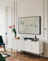 Summer Cuttings III Green Crop by Julia Purinton. shown as a framed stretched canvas in a living room above a console. Available as a archival giclee rolled canvas, fine art paper, or poster print. SKU 54530i.