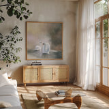 Swans in Mist by Julia Purinton. Shown in a natural wood frame in a cozy modern living room. Available as an archival giclee rolled canvas, fine art paper, or poster print. SKU 76020a.