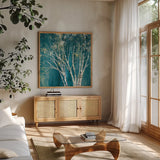Teal Birch by Julia Purinton. Shown in a natural wood frame in a cozy modern living room. Available as an archival giclee rolled canvas, fine art paper, or poster print. SKU 37740a.
