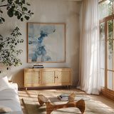Tidewall by Julia Purinton. Shown in a natural wood frame in a cozy modern living room. Available as an archival giclee rolled canvas, fine art paper, or poster print. SKU 103235a.
