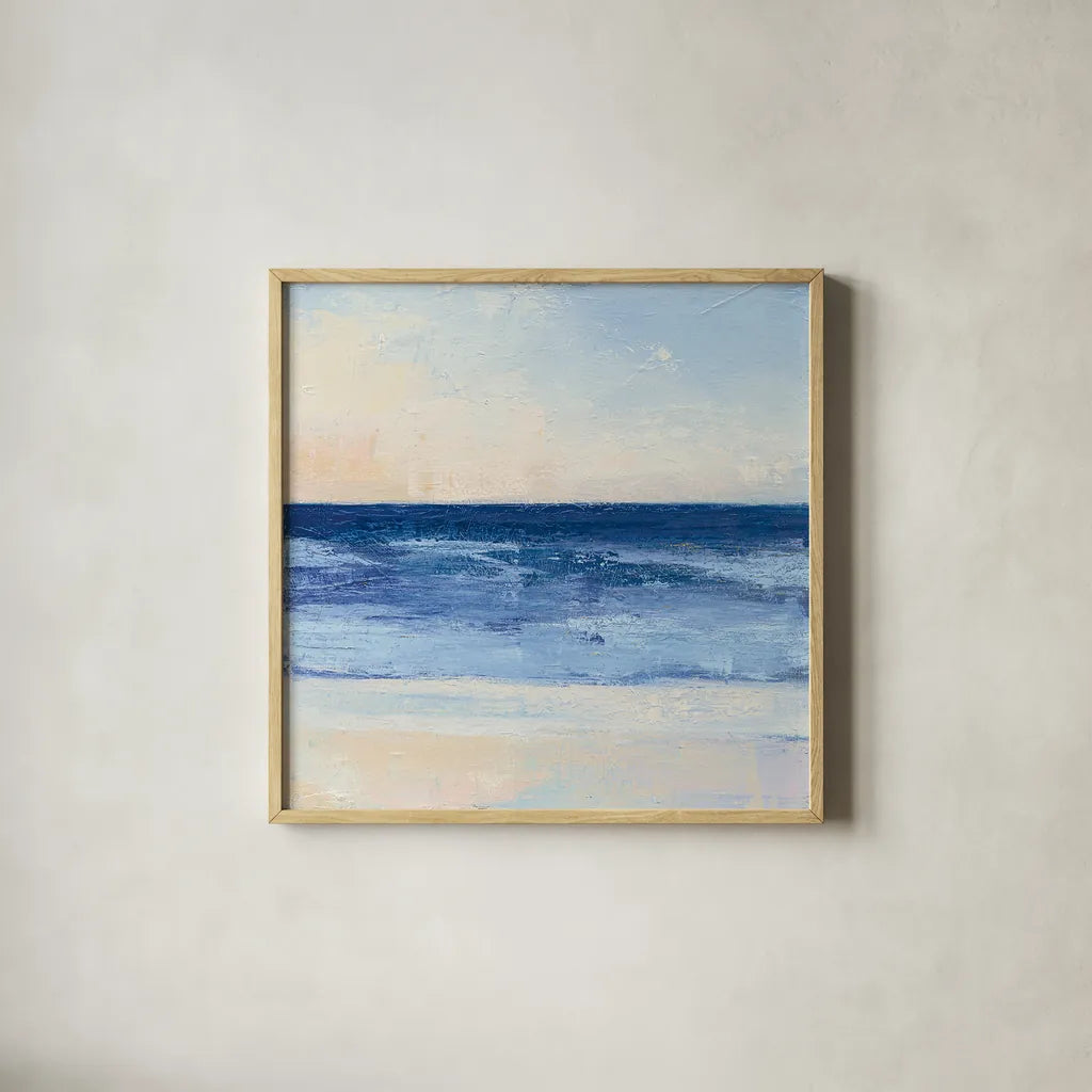True Blue Ocean II by Julia Purinton. Shown in a natural wood glass frame for a timeless modern aesthetic. Available as an archival giclee rolled canvas, fine art paper, or poster print. SKU 24587a.