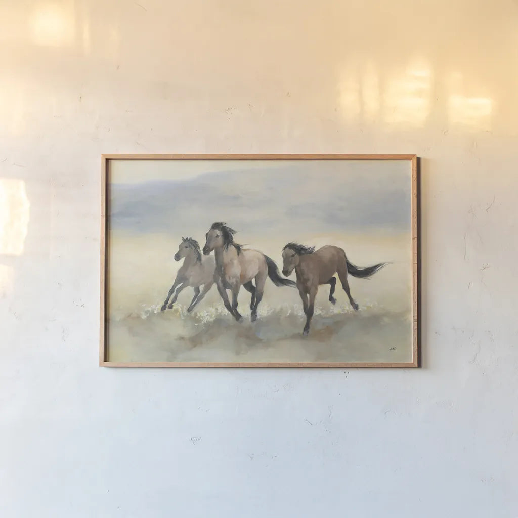 Wild Mustangs by Julia Purinton. shown as a paper print in a natural frame. Available as a archival giclee rolled canvas, fine art paper, or poster print. SKU 70759i.