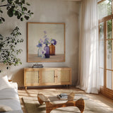 Windowsill Garden I by Julia Purinton. Shown in a natural wood frame in a cozy modern living room. Available as an archival giclee rolled canvas, fine art paper, or poster print. SKU 54616a.