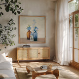 Windowsill Garden II Blue by Julia Purinton. Shown in a natural wood frame in a cozy modern living room. Available as an archival giclee rolled canvas, fine art paper, or poster print. SKU 54993a.