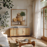 Woven Still Life by Julia Purinton. Shown in a natural wood frame in a cozy modern living room. Available as an archival giclee rolled canvas, fine art paper, or poster print. SKU 73764a.