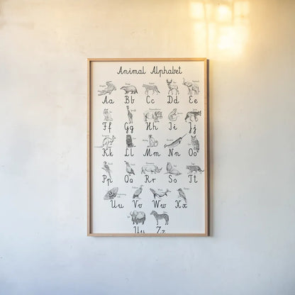 Animal Alphabet by Kasia Kucwaj-Tybur. shown as a paper print in a natural frame. Available as a archival giclee rolled canvas, fine art paper, or poster print. SKU 83201h.
