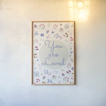 French Words VI Loved by Kasia Kucwaj-Tybur. shown as a paper print in a natural frame. Available as a archival giclee rolled canvas, fine art paper, or poster print. SKU 83641h.