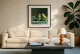 A Pair of Pears On Tablecloth by Kate Jarvik Birch. Displayed in a glass frame with matte in a clean modern living room. Available as an archival giclee rolled canvas, fine art paper, or poster print. SKU 101973a.