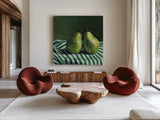 A Pair of Pears On Tablecloth by Kate Jarvik Birch. Shown as extra-large giant wall art in a modern living room. Available as an archival giclee rolled canvas, fine art paper, or poster print. SKU 101973a.