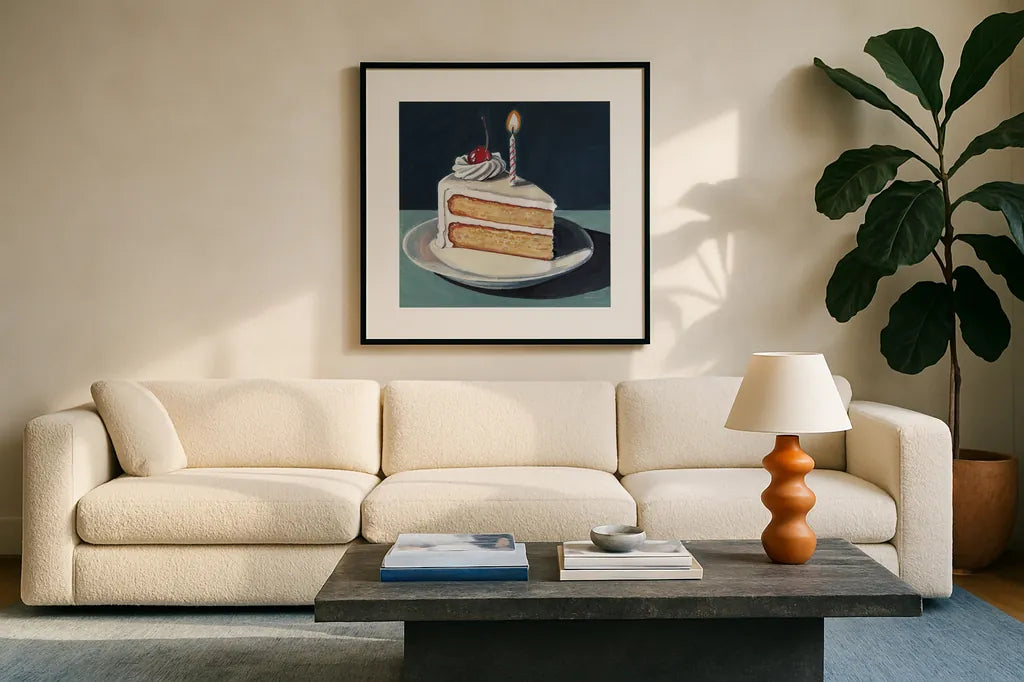 Birthday Slice With Cherry by Kate Jarvik Birch. Displayed in a glass frame with matte in a clean modern living room. Available as an archival giclee rolled canvas, fine art paper, or poster print. SKU 99693a.