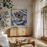 Black Coffee On Striped Cloth by Kate Jarvik Birch. Shown in a natural wood frame in a cozy modern living room. Available as an archival giclee rolled canvas, fine art paper, or poster print. SKU 98776a.