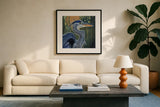 Blue Heron Backlit in Morning by Kate Jarvik Birch. Displayed in a glass frame with matte in a clean modern living room. Available as an archival giclee rolled canvas, fine art paper, or poster print. SKU 98608a.