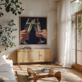 Cheers To Love by Kate Jarvik Birch. Shown in a natural wood frame in a cozy modern living room. Available as an archival giclee rolled canvas, fine art paper, or poster print. SKU 98617a.
