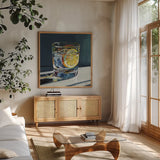 Clear Cocktail With Lemon by Kate Jarvik Birch. Shown in a natural wood frame in a cozy modern living room. Available as an archival giclee rolled canvas, fine art paper, or poster print. SKU 99772a.