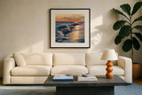 Colorful Sunset on The Waves by Kate Jarvik Birch. Displayed in a glass frame with matte in a clean modern living room. Available as an archival giclee rolled canvas, fine art paper, or poster print. SKU 98594a.