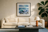 Curling Wave on Shore by Kate Jarvik Birch. Displayed in a glass frame with matte in a clean modern living room. Available as an archival giclee rolled canvas, fine art paper, or poster print. SKU 98565a.