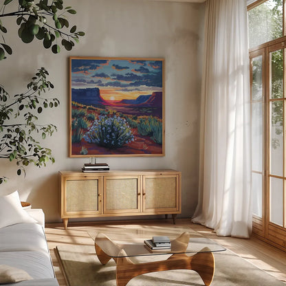Desert Sunset On Blooming Bush by Kate Jarvik Birch. Shown in a natural wood frame in a cozy modern living room. Available as an archival giclee rolled canvas, fine art paper, or poster print. SKU 98560a.