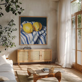 Fresh Kitchen Lemons by Kate Jarvik Birch. Shown in a natural wood frame in a cozy modern living room. Available as an archival giclee rolled canvas, fine art paper, or poster print. SKU 98562a.