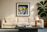 Fresh Kitchen Lemons by Kate Jarvik Birch. Displayed in a glass frame with matte in a clean modern living room. Available as an archival giclee rolled canvas, fine art paper, or poster print. SKU 98562a.