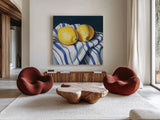 Fresh Kitchen Lemons by Kate Jarvik Birch. Shown as extra-large giant wall art in a modern living room. Available as an archival giclee rolled canvas, fine art paper, or poster print. SKU 98562a.