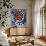Fresh Picked Kitchen Strawberries by Kate Jarvik Birch. Shown in a natural wood frame in a cozy modern living room. Available as an archival giclee rolled canvas, fine art paper, or poster print. SKU 98592a.