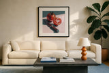 Fresh Sliced Tomato by Kate Jarvik Birch. Displayed in a glass frame with matte in a clean modern living room. Available as an archival giclee rolled canvas, fine art paper, or poster print. SKU 100953a.