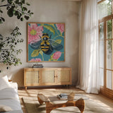 Fuzzy Bee on Floral Wall by Kate Jarvik Birch. Shown in a natural wood frame in a cozy modern living room. Available as an archival giclee rolled canvas, fine art paper, or poster print. SKU 98563a.